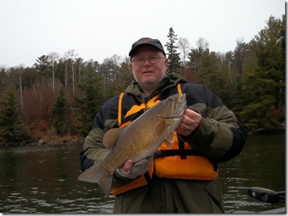 Joe with smallmouth caught across from Lund's cabin.