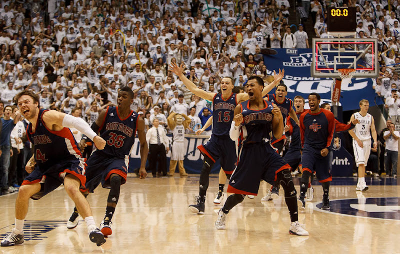 Saint Mary's players celebrate after Saint Mary's guard Matthew Dellavedova (4) hit a last-second shot to win the game. BYU hosts Saint Mary's, college basketball Wednesday January 16, 2013 in Provo