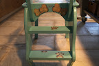 Ah-ha!  There are steps up the backside with paw prints painted on them!