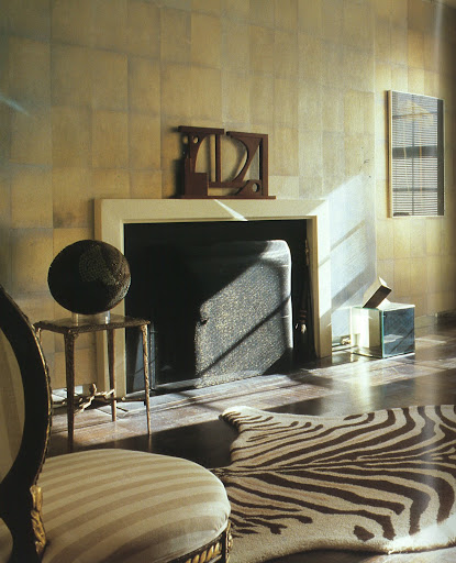 Shimmering walls covered with silver tea paper and a lacquered ceiling showcase carefully curated collection of Neoclassical and Modern furnishings in the living room of Albert Hadley's New York City apartment. (Regency Redux, Rizzoli)
