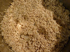 Add the rinsed quinoa to the pan with the cooked onion and garlic.