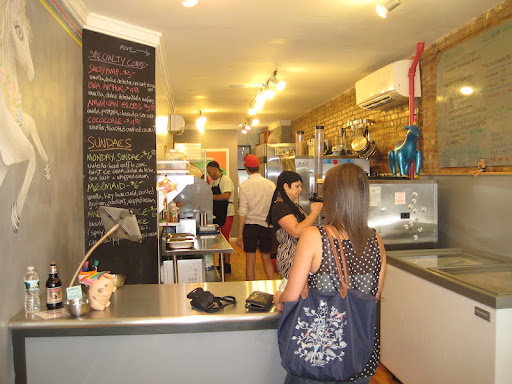 The inside of Big Gay Ice Cream Shop, which is decorated with unicorns and bright, bold colors. The inside of Big Gay Ice Cream Shop, which is decorated with unicorns and bright, bold colors.