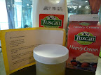 Milk, cream, and lemon juice combined with salt-all the ingredients for homemade ricotta.