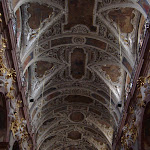 High ceilings.  Baroque-style ornaments.  Scaffolding.