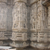 Leftmost image is another example of strange image where there is something help in upper two hands. One lower hand is holding a kamandalu and another lower hand is in varada pose. There is a vessel placed near the feet at the base. The other two left figure, we will in details in next picture.