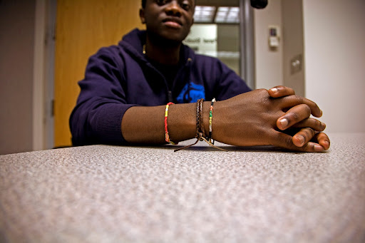 Michel Chikwanine , a former child soldier, tells KSMU's Jennifer Moore his life story. Photo Credit: Alex Crowder
