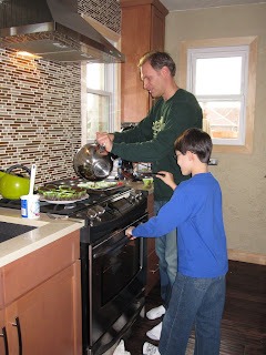 Kai and James making cupcakes