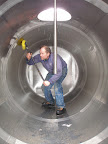 Scrubbing the inside of one of our 3100 gal. sap tanks. We try to do this every day.