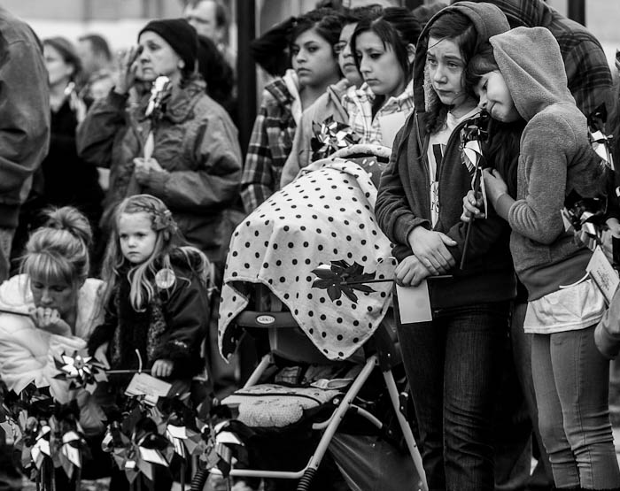 Raquel Trujillo is comforted by Saray Becerra at a community pinwheel vigil put on by Prevent Child Abuse Utah for Charlie and Braden Powell in the Municipal Gardens Playground Thursday, February 9, 2012 in Ogden, Utah.