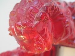 Pair of red Fu Dog acrylic resin sculptures