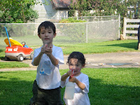 Kai and Eidan getting the cameraman (me) wet