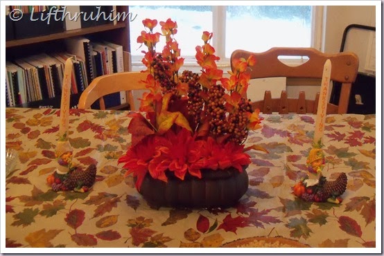 Dining room table all decorated for Thanksgiving.