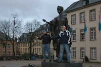 The girls paying tribute to an unknown Luxembourgian statue