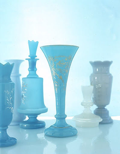 Enamel and gilt bouquets decorate a brilliant blue vase and turquoise decanter both with characteristically Bristol crenellated tops, and a shiny, trumpet-shape vase. (Martha Stewart Living) Enamel and gilt bouquets decorate a brilliant blue vase and turquoise decanter both with characteristically Bristol crenellated tops, and a shiny, trumpet-shape vase. (Martha Stewart Living)