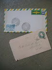 i love the airmail stripes seen here in green and yellow ( kind of unexpected) and on the second envelope we thought the embossed stamp (which is part of the actual envelope and not adhered separately) is pretty darn cool.