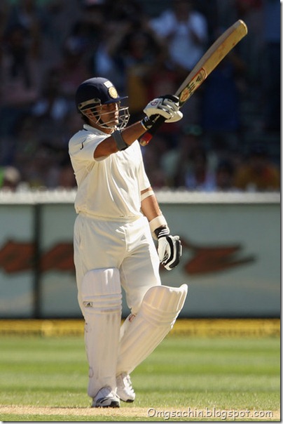 Sachin Tendulkar of India raises his bat to the crowd after reaching 50 runs during day two of the First Test match between Australia and India at the Melbourne Cricket Ground
