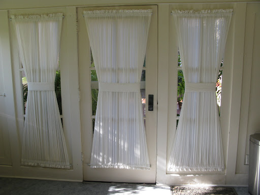 The kitchen doors have Swiss dot curtains. There are no words to describe how much I love these.