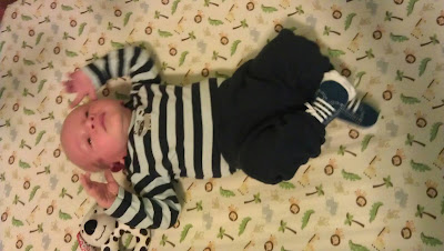 almost 3 weeks old and in 6 month clothes