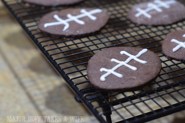 Iced football cookies. Looking for a fun party for your teenage boy? Why not throw a Football video game party? Easy ideas for how to entertain kiddos during the Big Game. Features DiGiorno pizza, personalized football cups, free printable lanyards, and an incredible recipe for football shaped ice cream sandwiches! #GameTimeMVP #CollectiveBias #ad Iced football cookies. Looking for a fun party for your teenage boy? Why not throw a Football video game party? Easy ideas for how to entertain kiddos during the Big Game. Features DiGiorno pizza, personalized football cups, free printable lanyards, and an incredible recipe for football shaped ice cream sandwiches! #GameTimeMVP #CollectiveBias #ad