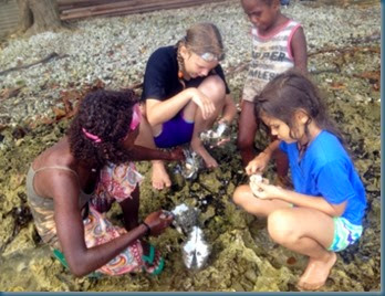 Girls cleaning shellfish