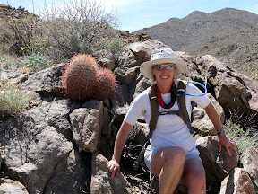 Mary next to a barrel cactus couple.