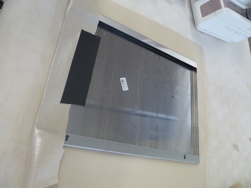 Using gaffer's tape to hold it in place.