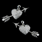 Diamond heart and arrow earrings add a playful wink to your big day.