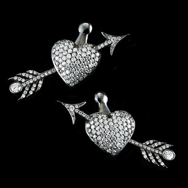 Diamond heart and arrow earrings add a playful wink to your big day.