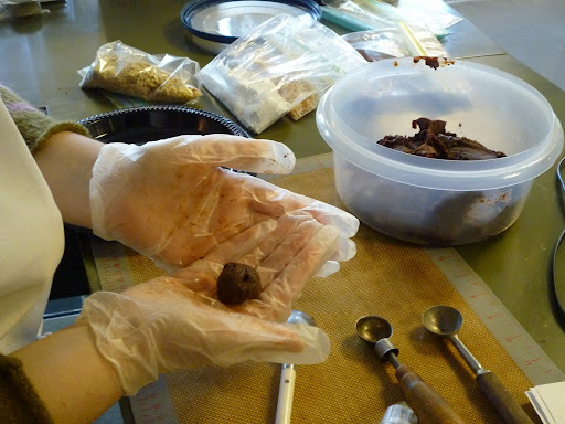 Truffle mix in the upper right and corner and Monty rolling truffles
