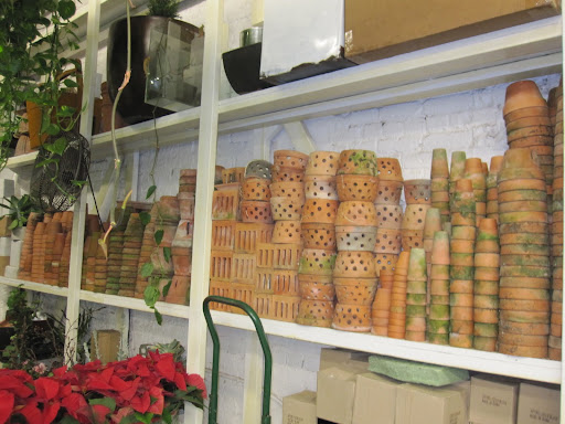 A variety of pots are stacked throughout the store.