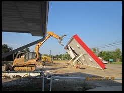 There goes the roof that used to be over the pumps There goes the roof that used to be over the pumps