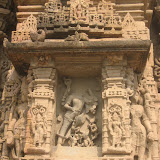 Shiva as Andhakantaka? His one leg is in alidhasana, raised up from the ground. He is shown with sixteen hands, which usually represents a samharamurti.