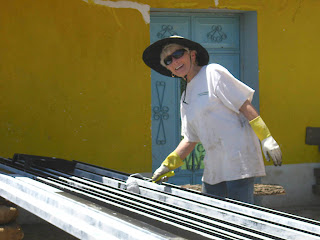 Caroline (Tom's mother) painting beams. Photos by TOM HART