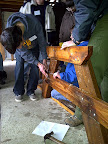 Bolting together the legs of a new picnic table