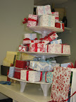 A tiered pedestal held neatly wrapped gifts.