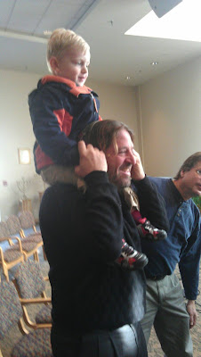 Andy on rabbi randys shoulders at tot Shabbat