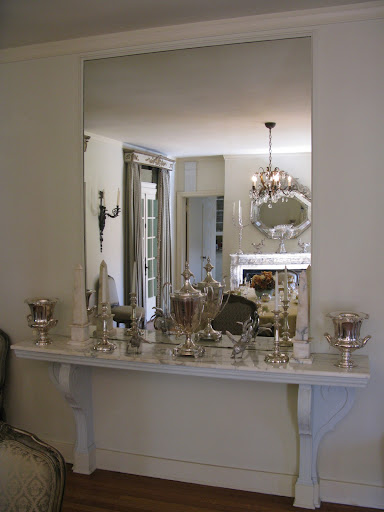 This sideboard in the dining area combines my two loves: silver and mirrors.