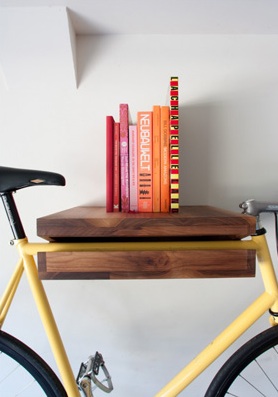 This piece does double duty as both a bike rack and a shelf. (Bike Shelf, Knife and Saw on etsy.com)