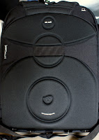 The back of the bag is nicely padded. There is also a elastic strap towards the top so that you can secure the bag on a strolley while travelling