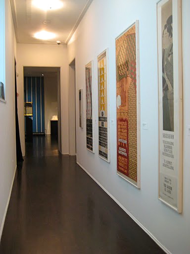 Old advertising prints from the 1900's line one of the corridors between galleries.