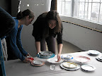 That's Callie again on the right, arranging the shot. And our awesome intern Stephanie helping her. We used lucite cubes under some of the plates to give some dimension to the shot.