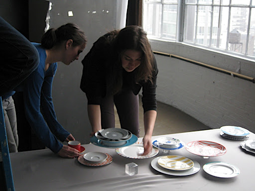 That's Callie again on the right, arranging the shot. And our awesome intern Stephanie helping her. We used lucite cubes under some of the plates to give some dimension to the shot.