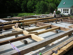 The eave walls are being assembled before the raising.