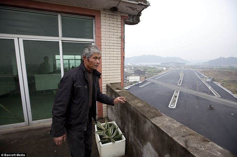 house-middle-of-road-5 house-middle-of-road-5