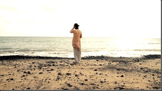 woman-standing-on-the-seashore woman-standing-on-the-seashore