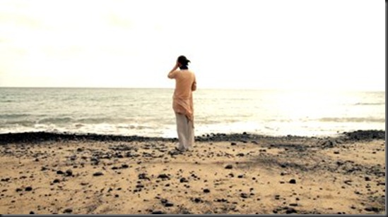 woman-standing-on-the-seashore