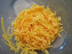 Grated cheddar cheese.
