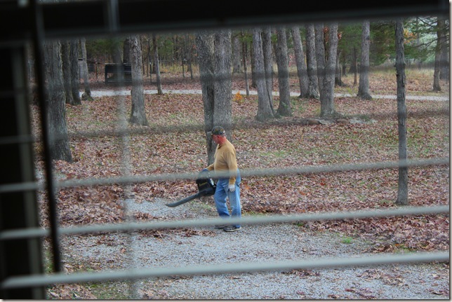 Jim blowing leaves off the driveway