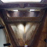 Wood chiseled to the fiberglass tabbing that was holding the bulkhead
