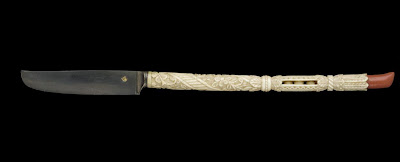 Pen knife | Origin:  Turkey | Period: 18th-19th century  Ottoman period | Details:  Not Available | Type: Elephant ivory, red coral, metal | Size: H: 22.5  W: 1.5   D: 1.0  cm | Museum Code: S1991.3 | Photograph and description taken from Freer and the Sackler (Smithsonian) Museums.